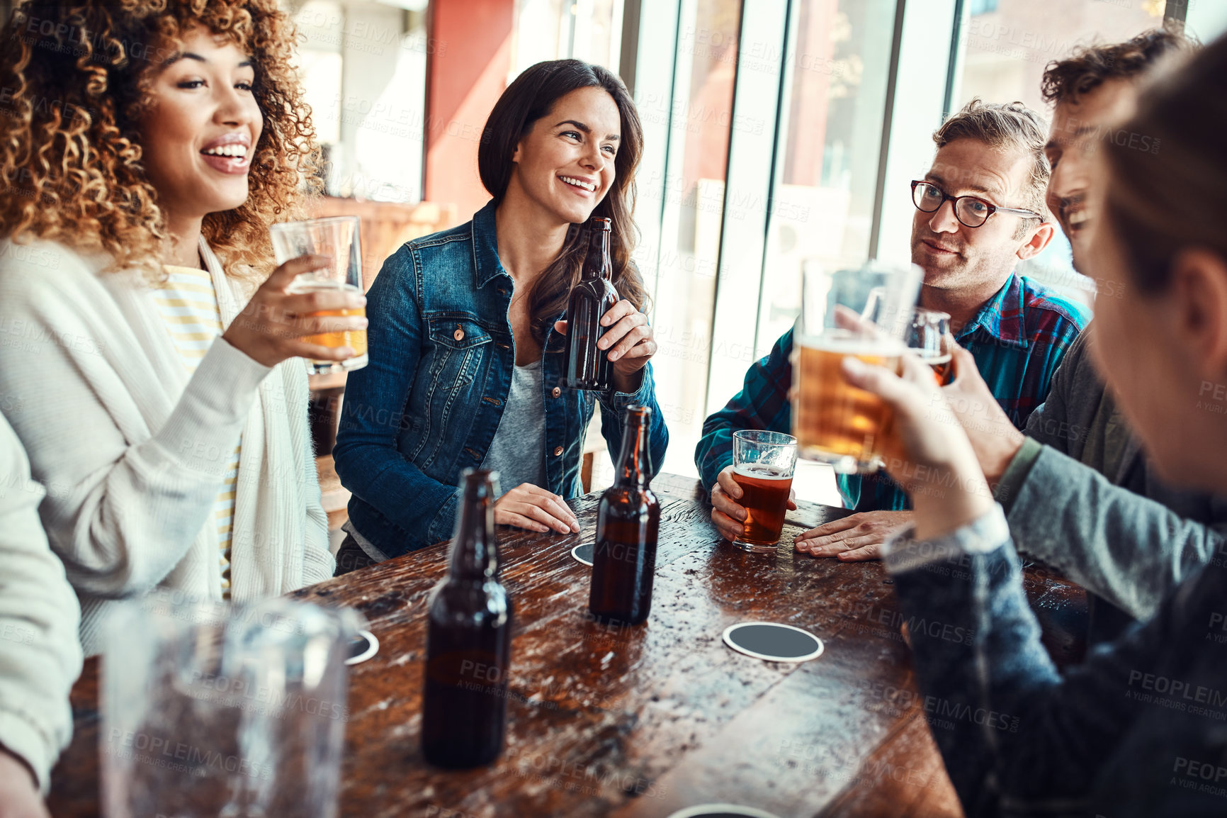 Buy stock photo Restaurant, beer and smile at hangout in celebration of birthday event in urban New York bar. Group of people with friends for happiness and gathering together with alcohol beverage at summer lunch