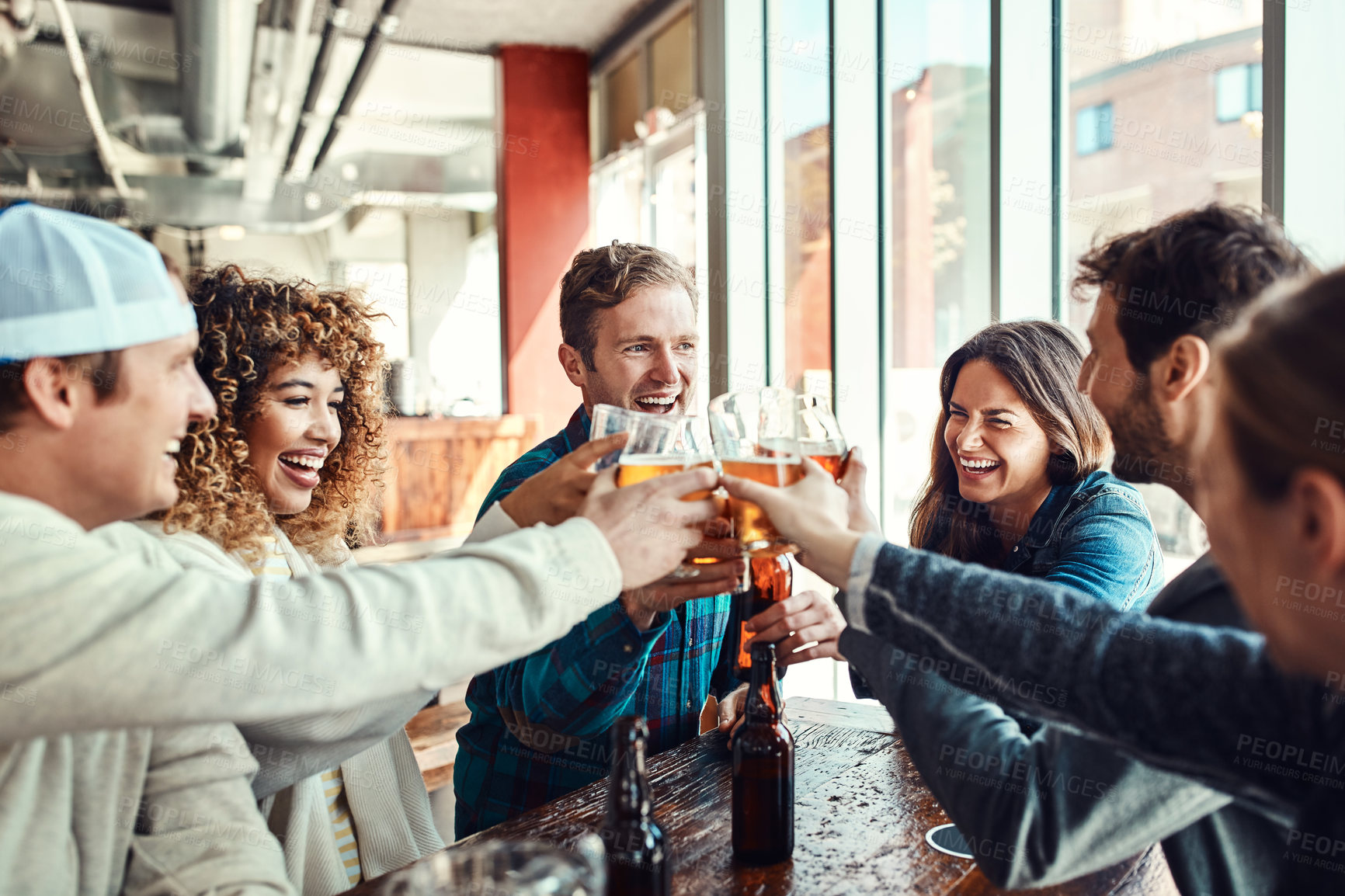 Buy stock photo Friends, people and cheers with beer in pub on date for reunion, gathering and fun. Glass, laughing and smile or happy for celebrating with bonding, drinking alcohol and together in bar for support