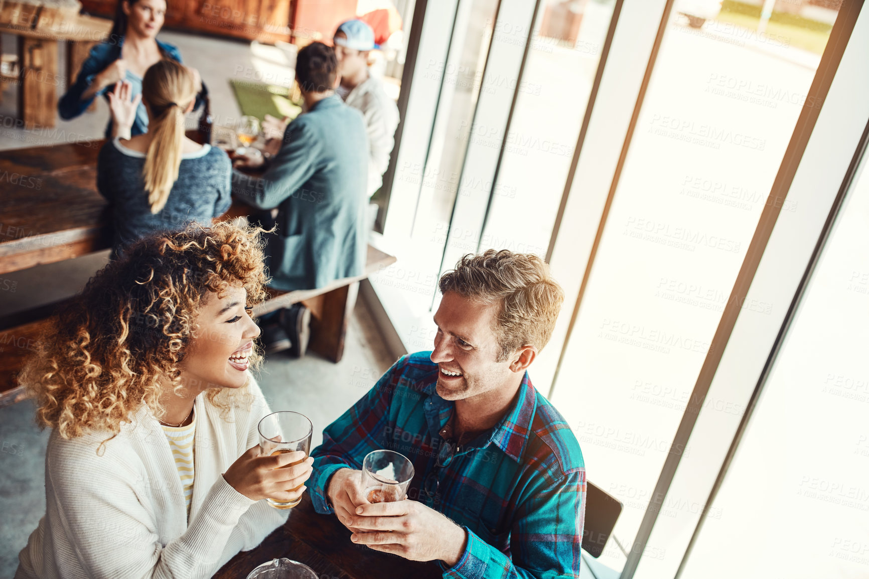 Buy stock photo Laugh, beer and relax with couple in pub for valentines day event, bonding and date. Happy hour celebration, alcohol drink and connection with man and woman at bar for pint and restaurant diner