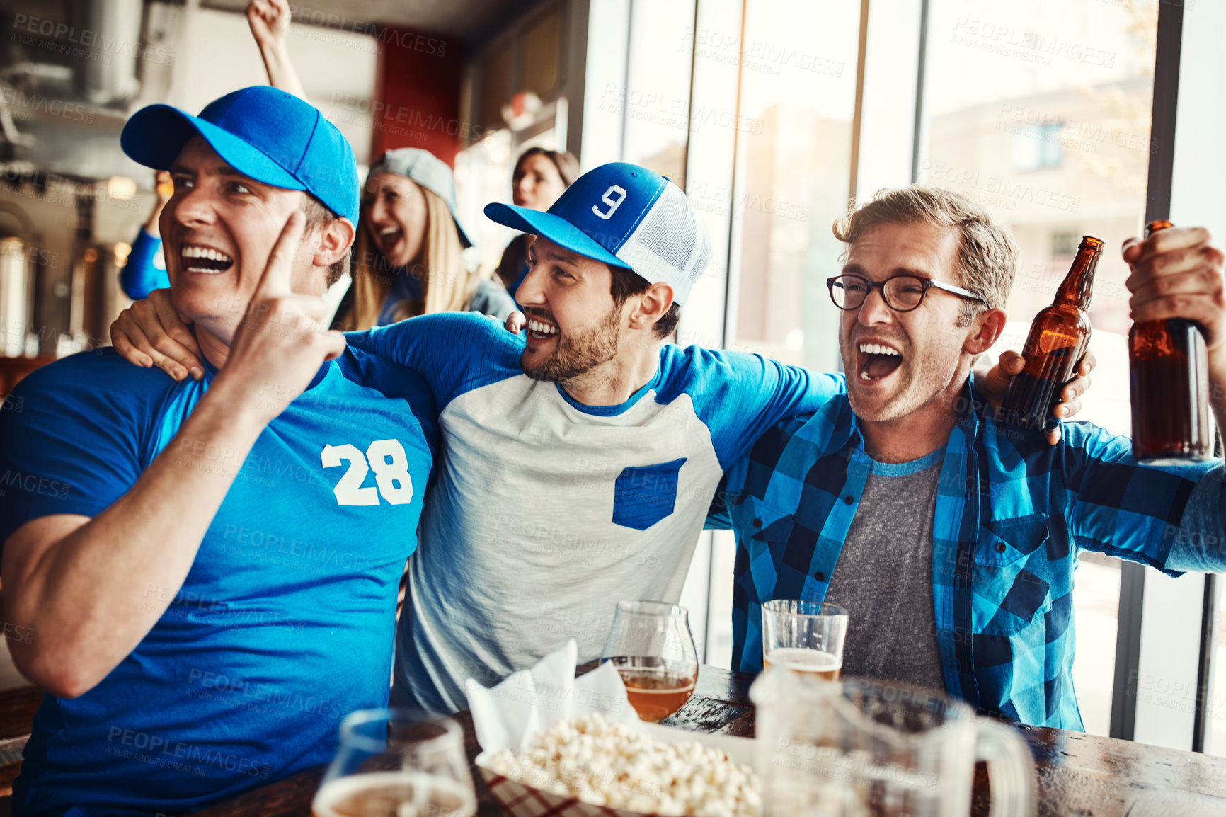 Buy stock photo Men, excited and sports game success, tournament victory and celebration of football league match event. People, cheering and team for support, fan and winning with beer of score achievement at pub
