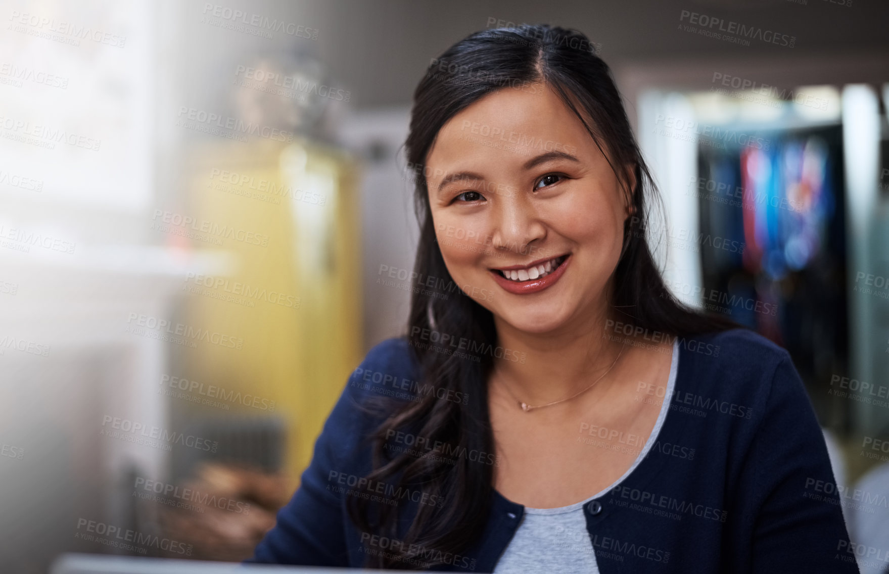 Buy stock photo Cropped portrait of an attractive young female entrepreneur working from home