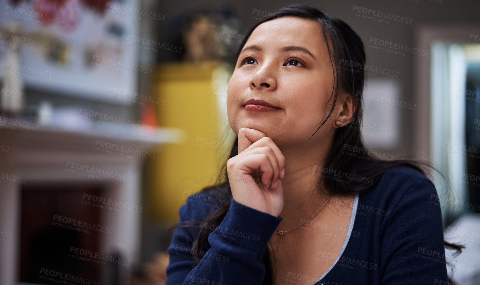 Buy stock photo Cropped shot of an attractive young female entrepreneur looking thoughtful while working from home