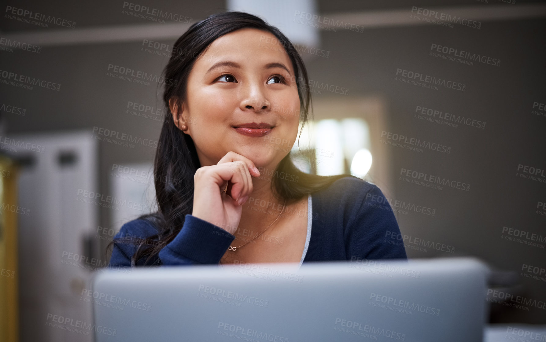 Buy stock photo Cropped shot of an attractive young female entrepreneur looking thoughtful while working from home