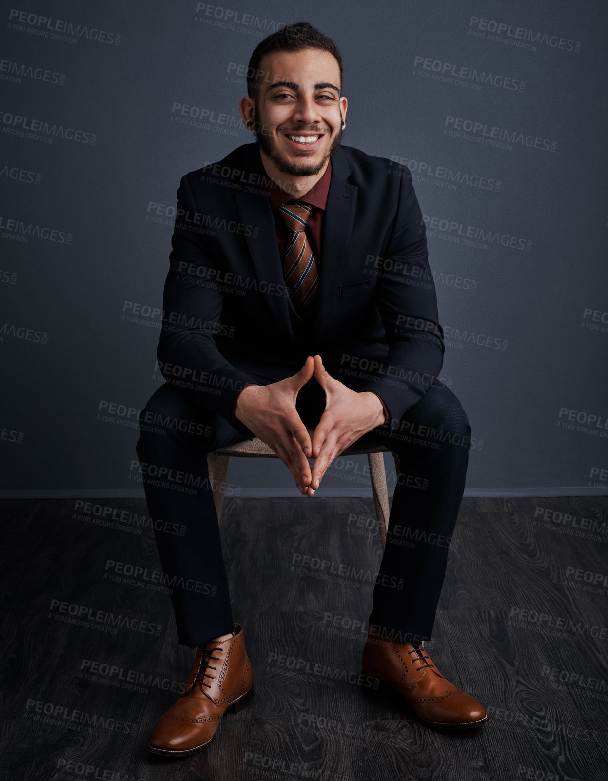 Buy stock photo Studio portrait of a stylish young businessman against a gray background