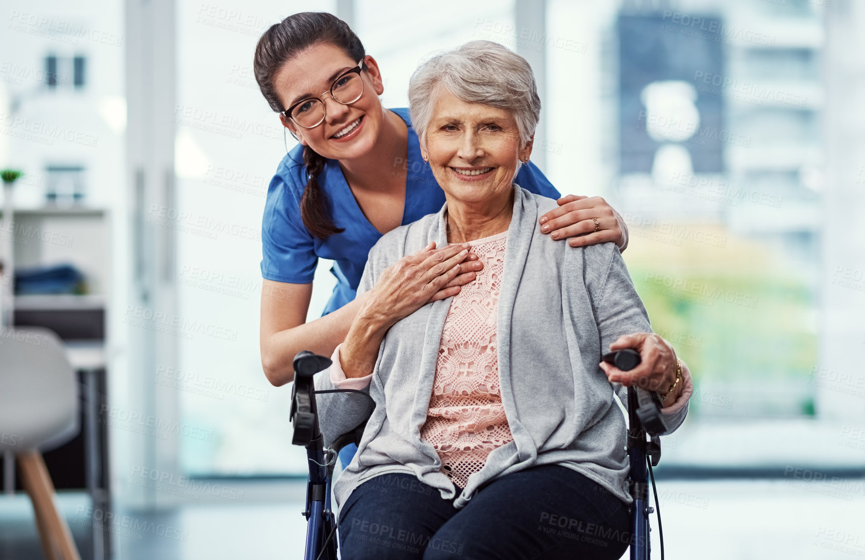 Buy stock photo Cropped portrait of a young female nurse and her senior patient in the old age home