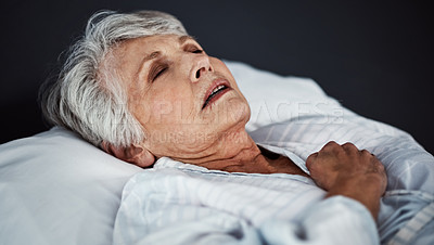 Buy stock photo High angle shot of a sickly senior woman lying in a hospital bed