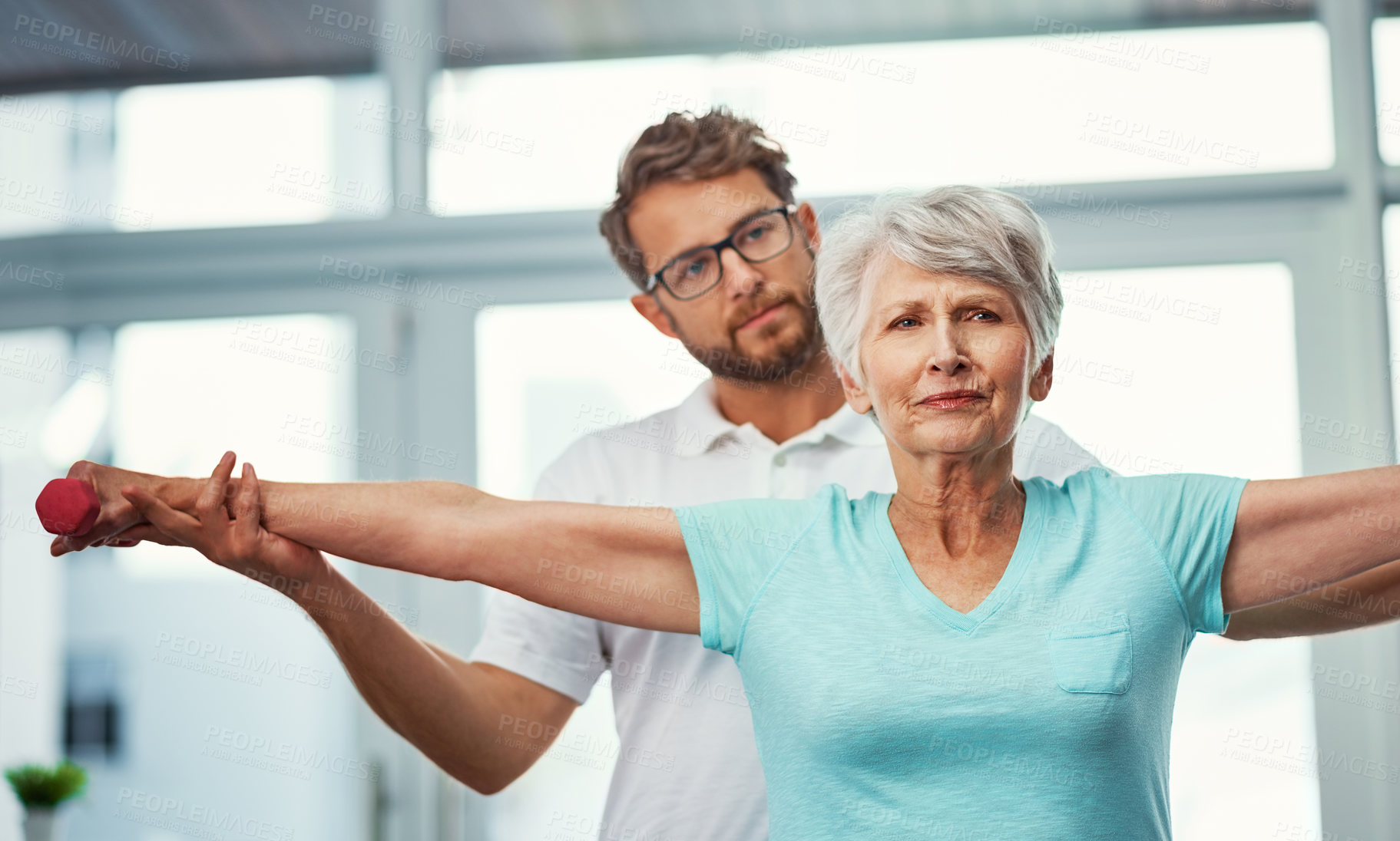 Buy stock photo Senior woman, stretching and dumbbells for physiotherapy of mobility, guidance and recovery. Elderly person, therapist and assessment for physical therapy, muscle strength and medical rehabilitation