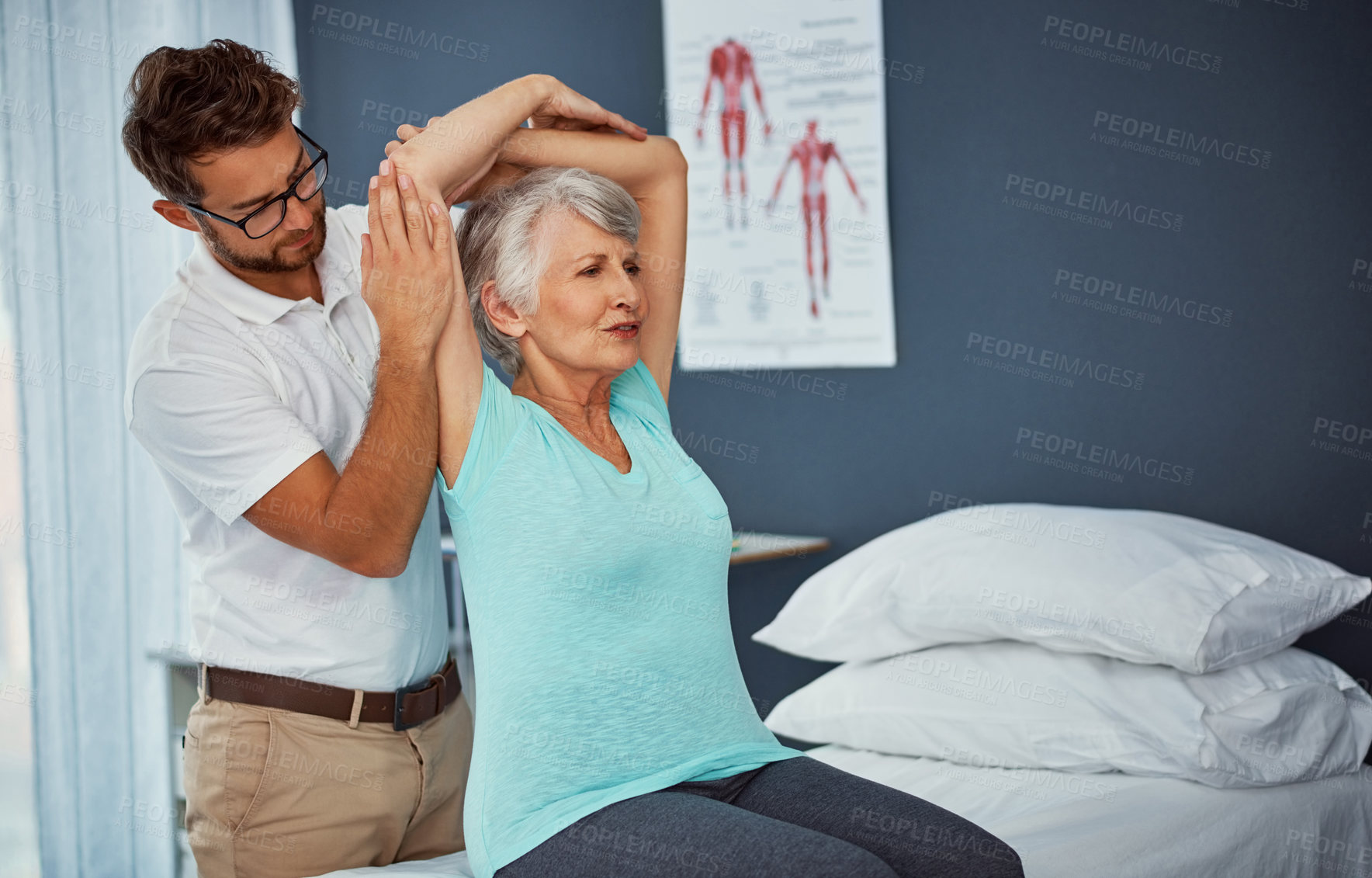 Buy stock photo Cropped shot of a senior woman working through her recovery with a male physiotherapist