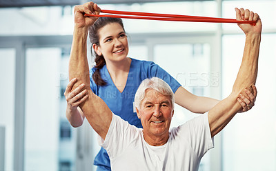 Buy stock photo Resistance band, senior man or help with physical therapist for healthcare, smile or portrait. Stretching, elderly patient and physiotherapy equipment, rehabilitation and muscle recovery in clinic
