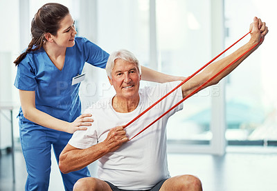 Buy stock photo Resistance band, elderly man and workout with physical therapist for healthcare, smile or help. Stretching, senior patient and nurse with physiotherapy equipment, rehabilitation or recovery in clinic