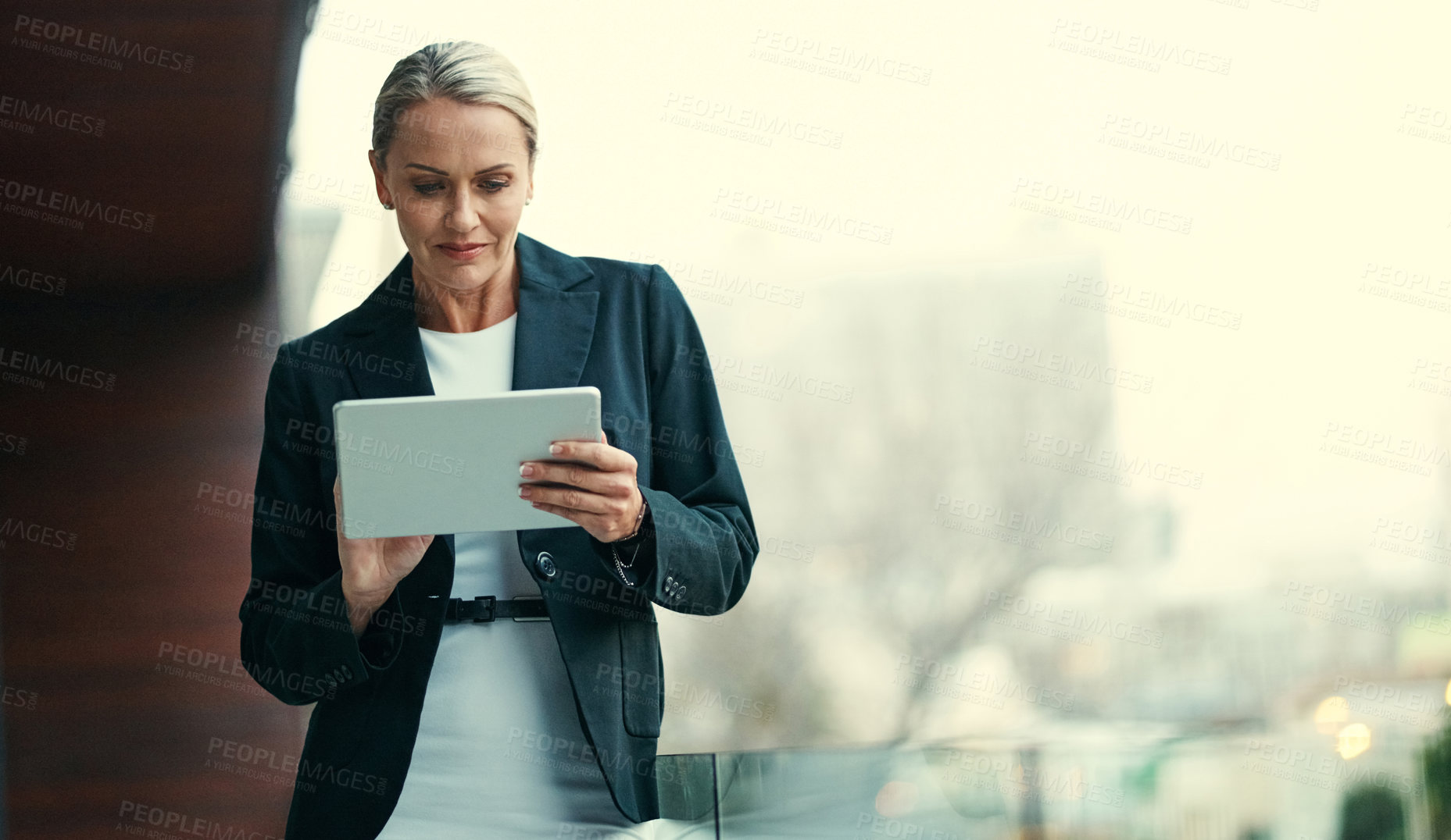 Buy stock photo Reading, report or woman on balcony with tablet, online communication or schedule update on email. Space, review or mature employee with tech, agenda change or networking on digital platform.
