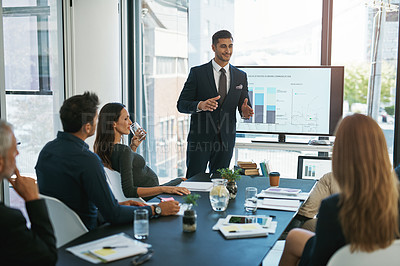 Buy stock photo Cropped shot of a young businessman giving a presentation in the boardroom