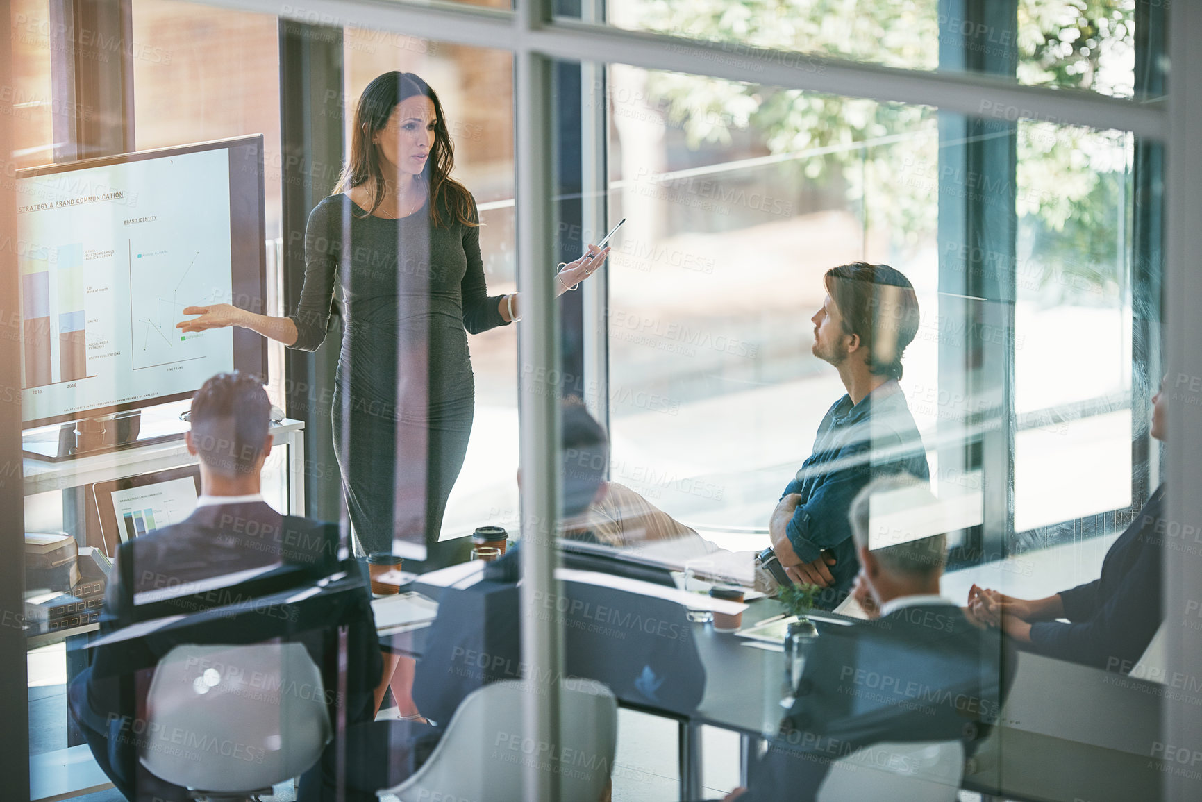 Buy stock photo High angle shot of a pregnant businesswoman giving a presentation in the boardroom