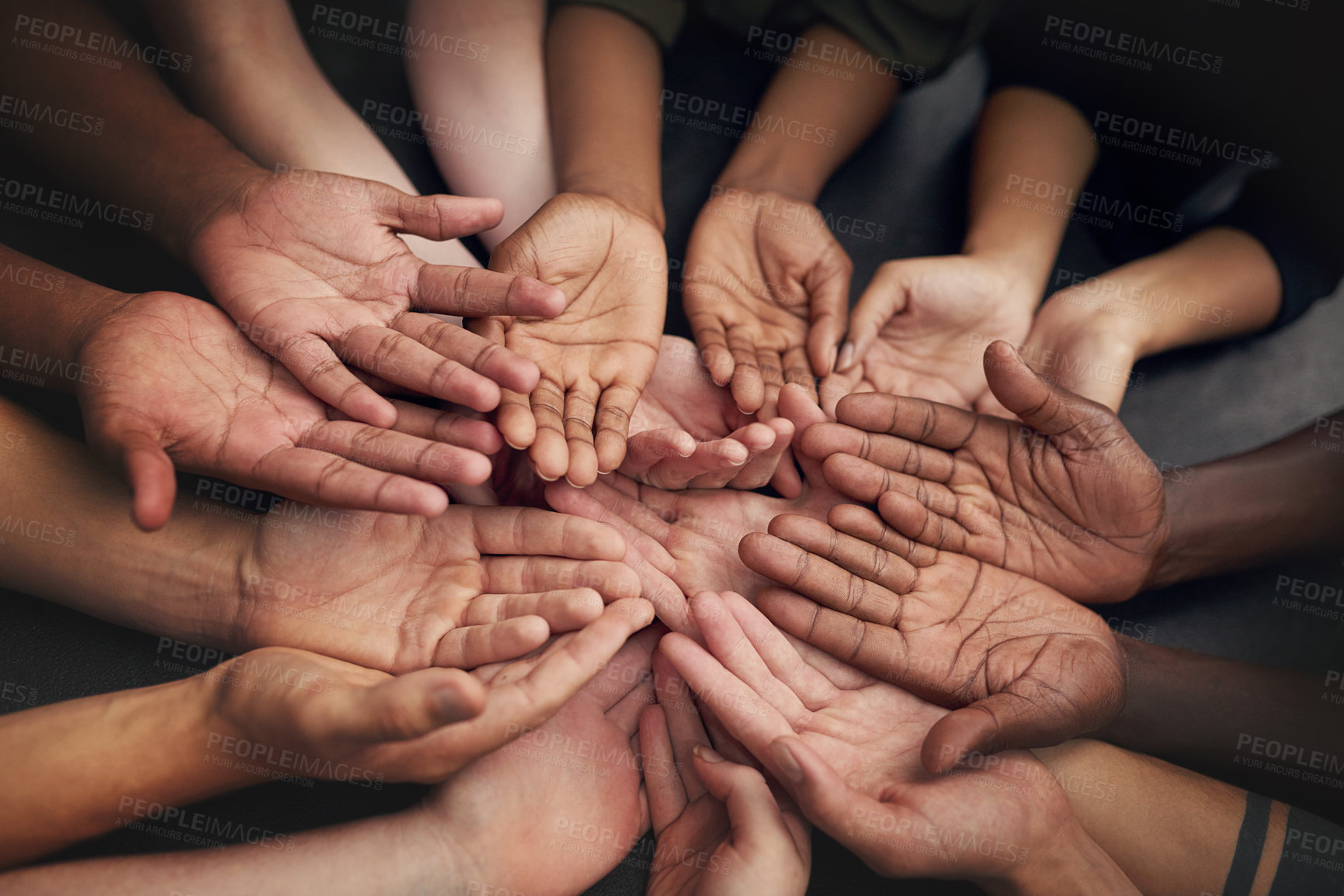 Buy stock photo High angle shot of a group of unrecognizable people's hands out with their palms open