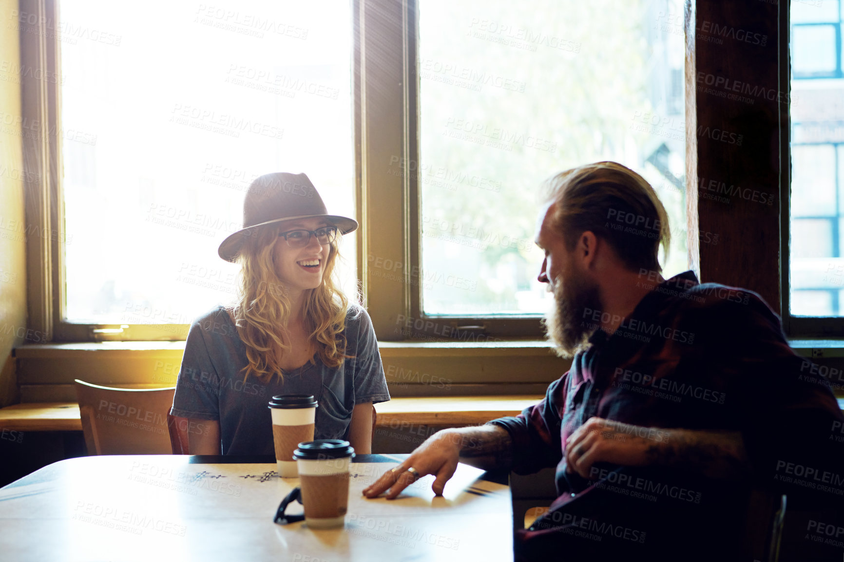 Buy stock photo Cropped shot of a hipster couple in a coffee shop