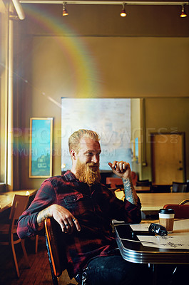 Buy stock photo Cropped shot of a male hipster in a coffee shop