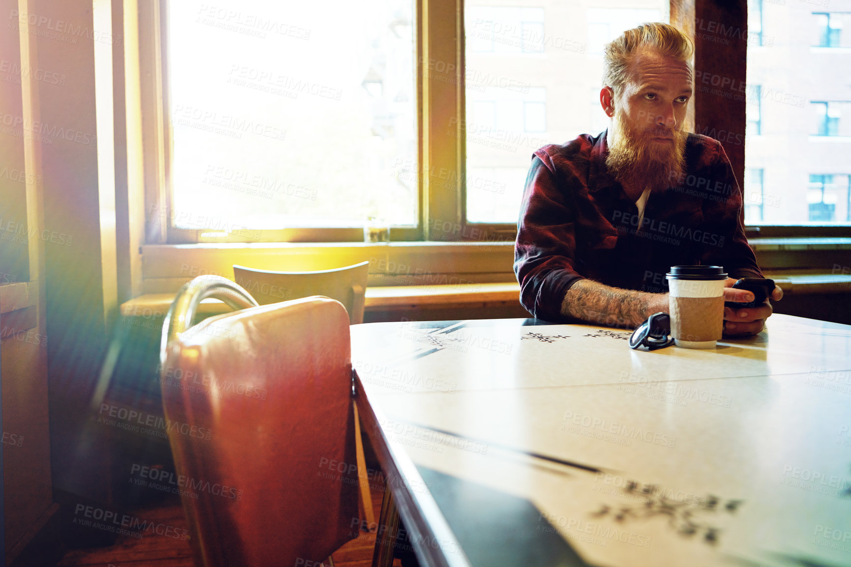 Buy stock photo Cropped shot of a male hipster in a coffee shop