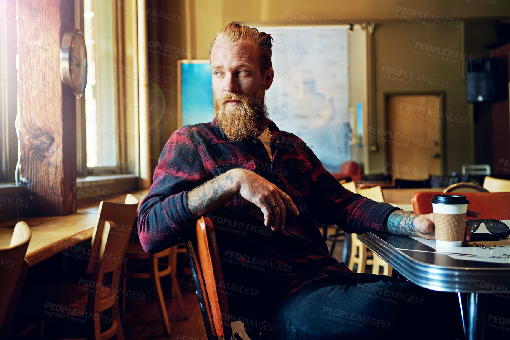 Buy stock photo Coffee shop, thinking and man with latte, serious or waiting for late date, caffeine and hospitality. Customer, reflection and person with drink in cafe, wonder and thoughtful for appointment delay