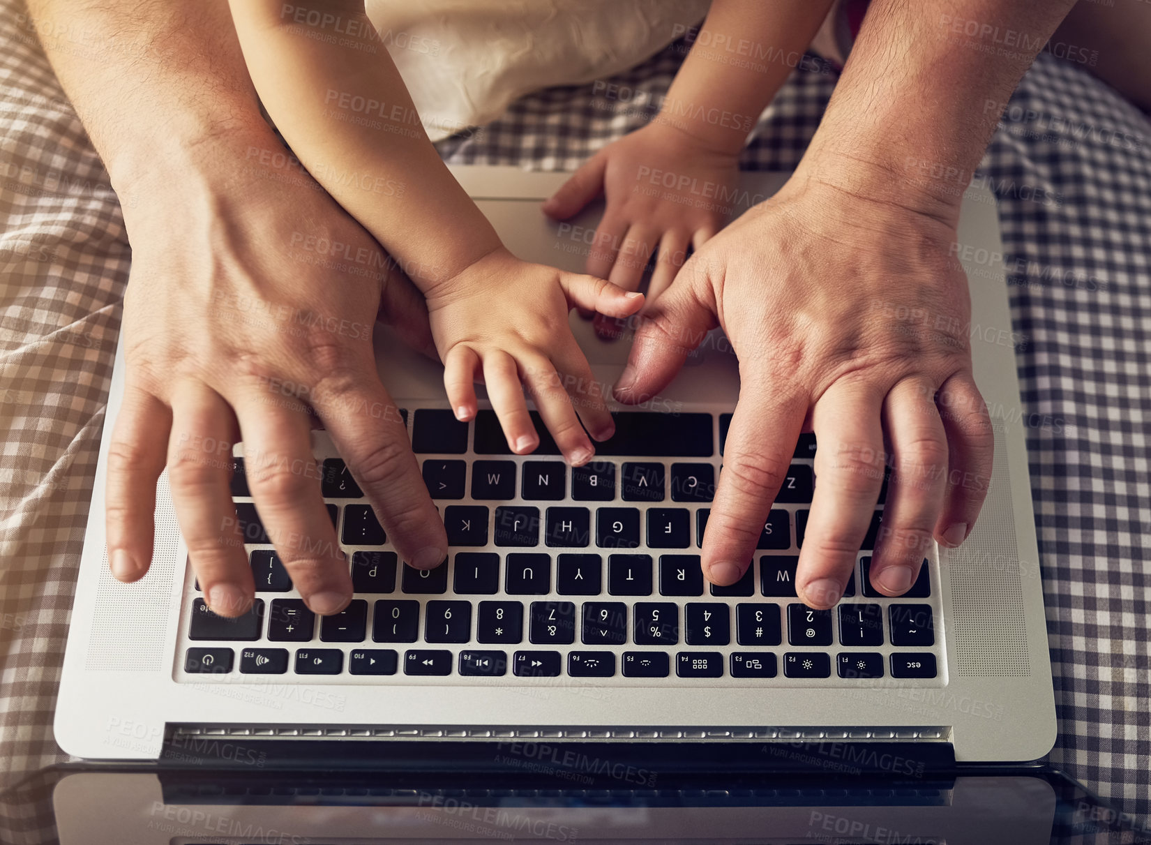 Buy stock photo High angle shot of an unrecognizable father and daughter playing on a laptop