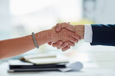 Buy stock photo Cropped shot of two businesspeople shaking hands