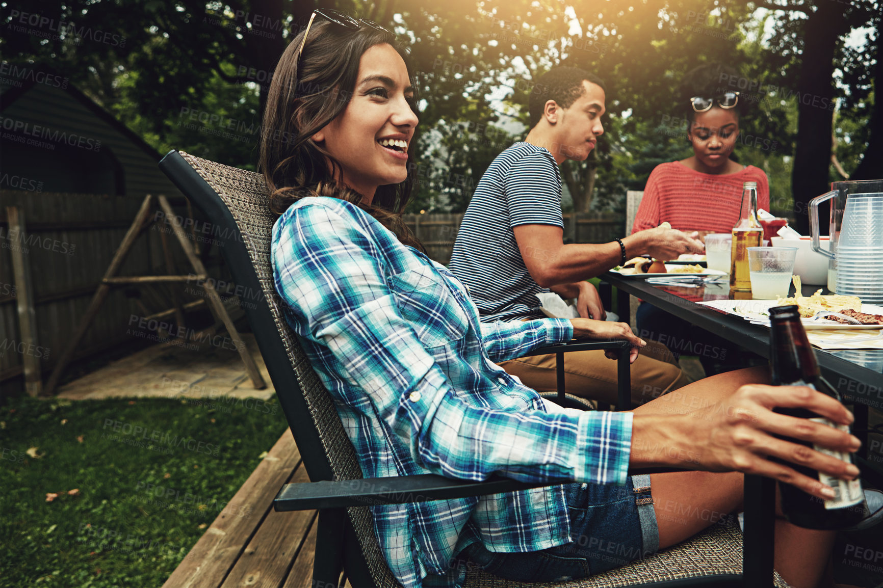 Buy stock photo Outdoor, party and woman with beer, smile and meal for gathering in weekend, break and reunion. Backyard, people and friends together with food, enjoy and cooking for celebration, lunch and drinks