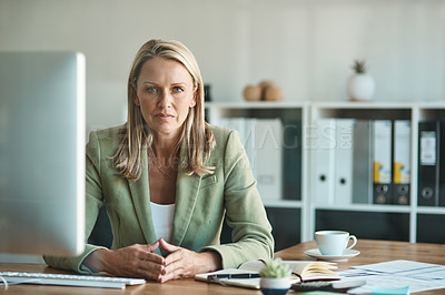Buy stock photo Cropped portrait of a mature businesswoman sitting in her corporate office
