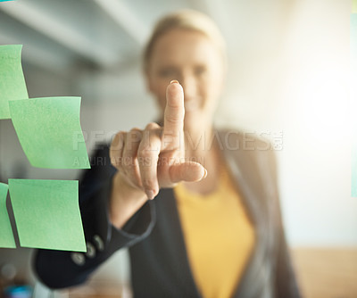 Buy stock photo Closeup shot of a mature corporate businesswoman's hand touching a glass wipe board