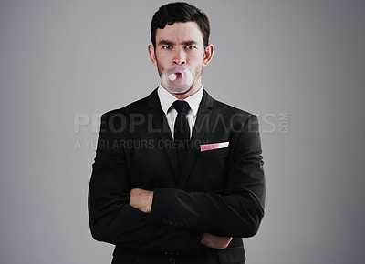Buy stock photo Studio shot of a well-dressed man posing against a gray background