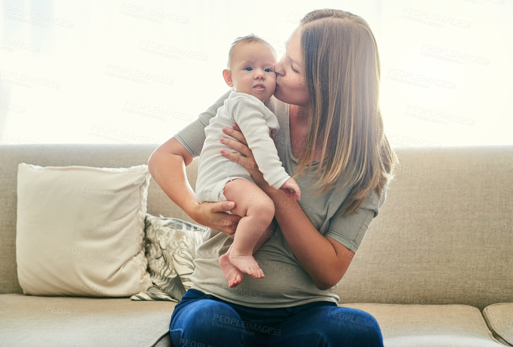 Buy stock photo Kiss, love or security with mother and baby on sofa in living room of home together for bonding. Development, family or growth with single parent woman and infant child in apartment for safety