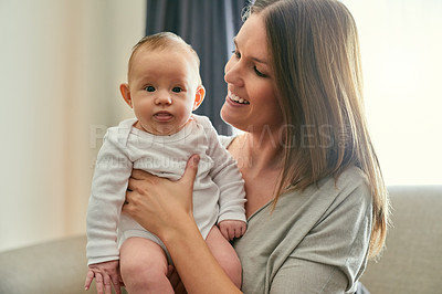 Buy stock photo Love, security and smile with mother and baby on sofa in living room of home together for bonding. Development, family or growth with happy single parent woman and cute infant child in apartment