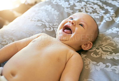 Buy stock photo Baby, laughing and relax on bed at house on calm morning, funny game and diaper change in cozy nursery. Child, comic and rest for babbling for crib fun, playful and adorable of development growth