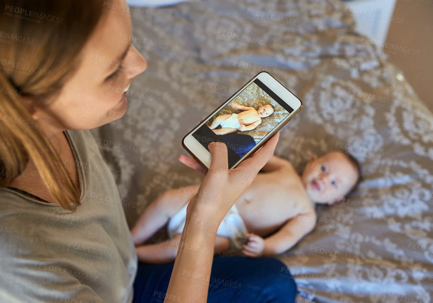 Buy stock photo Shot of a young mother and her baby at home