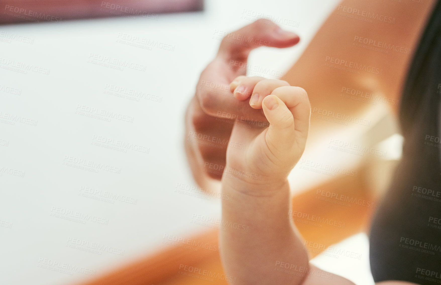 Buy stock photo Mother, baby and hand holding with love at house for playful care, family bonding and nurture support of connection. Woman, infant and fingers for security, emotional touch and growth of development