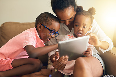 Buy stock photo Mother, children and relax on sofa with tablet for screen time, online storytelling and apps for growth or development. Mom, siblings and home with internet for entertainment, games and streaming.