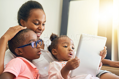 Buy stock photo Mom, children and relax on couch with tablet for screen time, online storytelling and apps for growth or development. Mother, siblings and home with internet for entertainment, games and streaming.