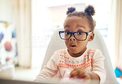 Buy stock photo Cropped portrait of an adorable little girl looking shocked while sitting down at home