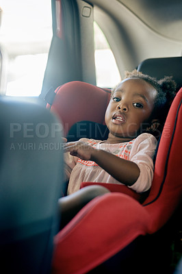 Buy stock photo Car, travel and girl in back seat on road trip for holiday, vacation and weekend getaway. Safety, child and happy kid with seatbelt for transportation, driving commute and journey in motor vehicle