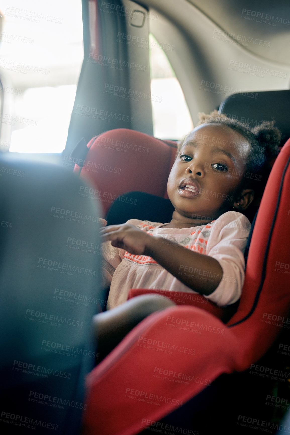 Buy stock photo Car, travel and girl in back seat on road trip for holiday, vacation and weekend getaway. Safety, child and happy kid with seatbelt for transportation, driving commute and journey in motor vehicle