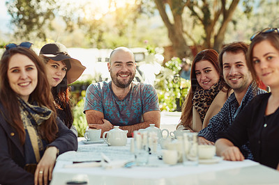 Buy stock photo Shot of a group of friends having lunch together