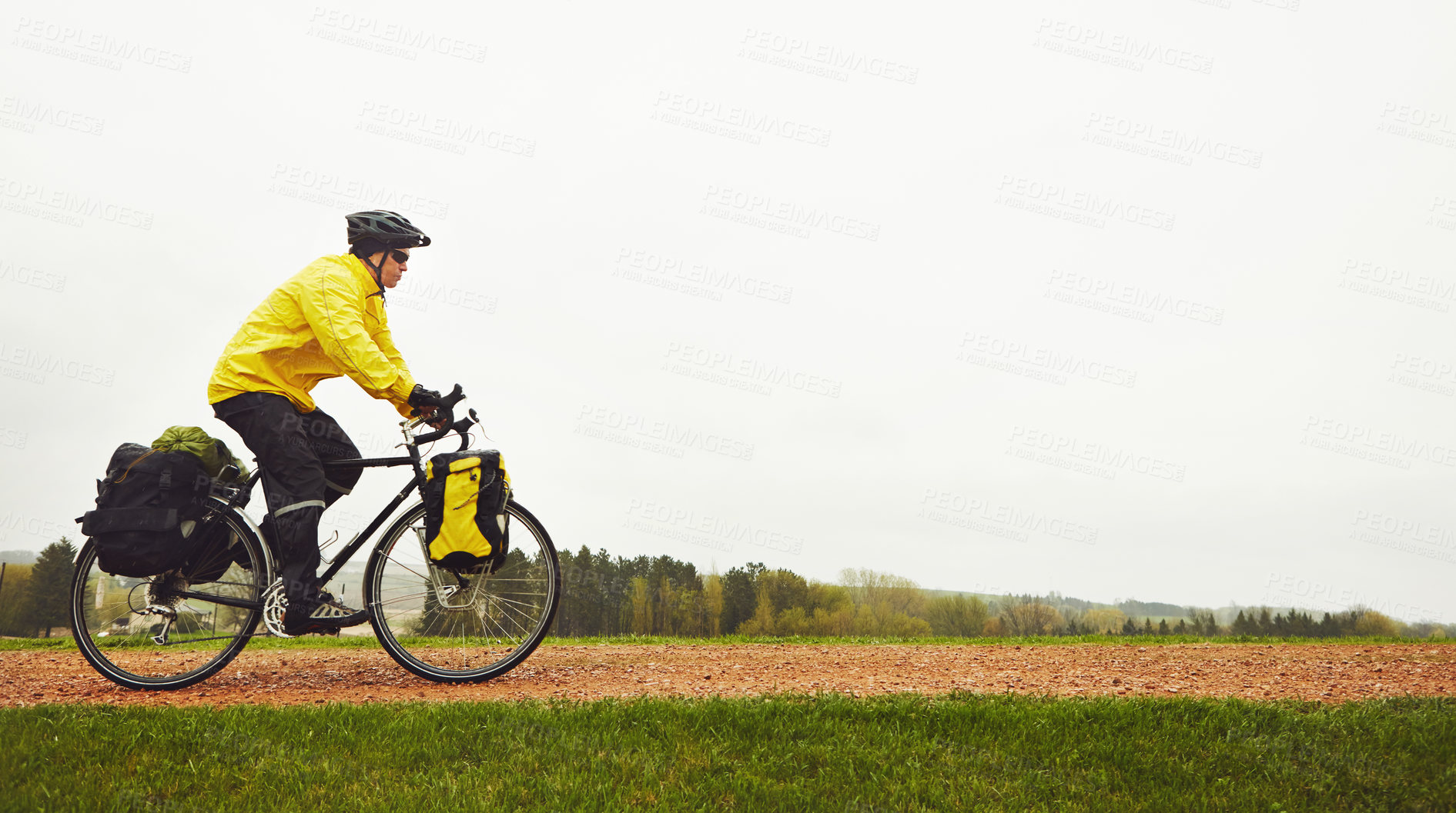 Buy stock photo Countryside, sports and man on bicycle with space for exercise, training and practice for active hobby. Outdoor, nature and person on bike for cycling, workout and endurance for wellness and health