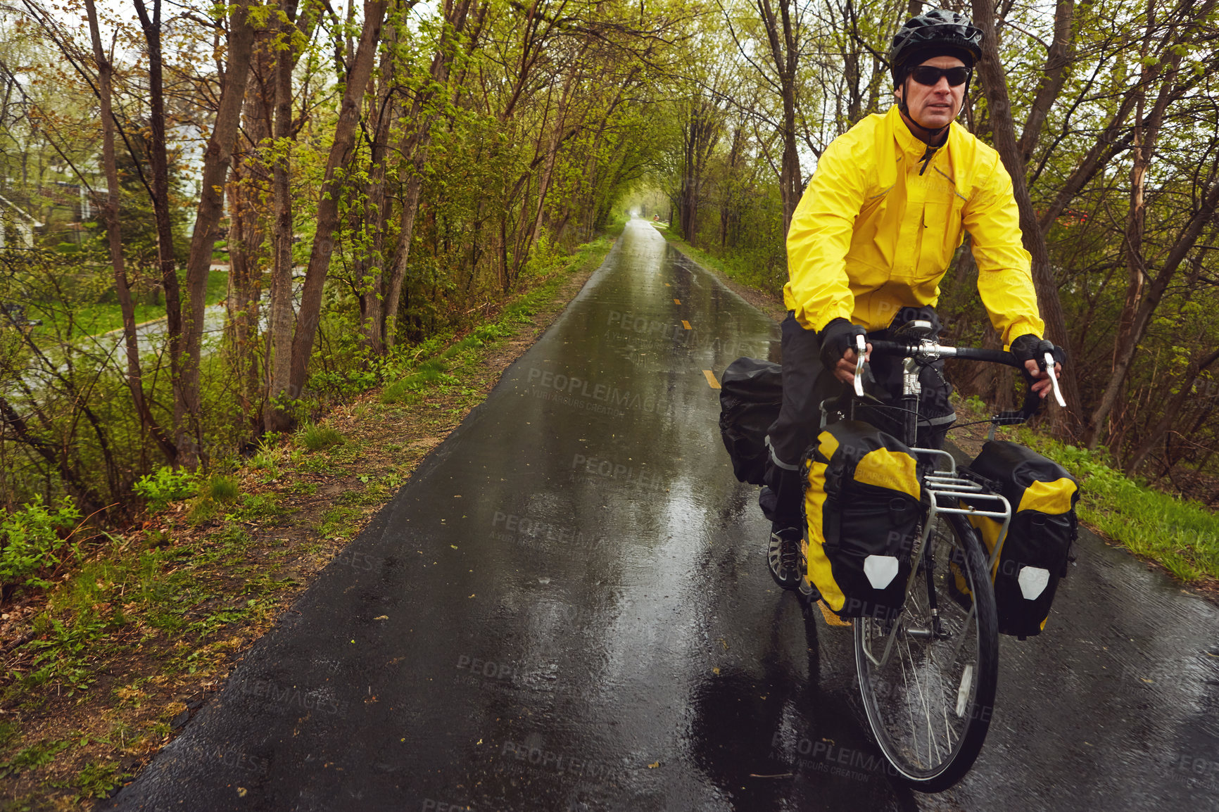 Buy stock photo Winter, man and adventure in countryside with bicycle, fitness and eco friendly transport for journey. Mature person, cycling and travel on wet road with bike, cold climate and outdoor for weekend.