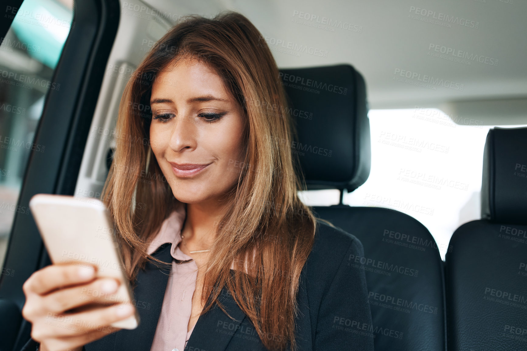 Buy stock photo Phone, taxi and text with business woman in car for ehailing service, private chauffeur and contact. Commute, transport navigation app and communication with person and mobile in vehicle for trip