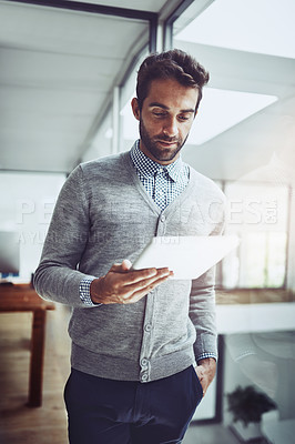 Buy stock photo Serious, reading and businessman in office with tablet for contact, communication and work for corporate career. Vision, professional or broker with technology for internet in workspace or agency