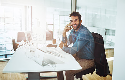 Buy stock photo Man, desk and phone in office with computer for job, communication or talking with technology. Male person, electronics and connection in workplace for investment or crypto, smile for deal or trade