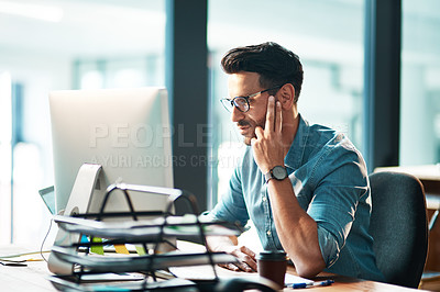 Buy stock photo Professional corporate business man working on computer, browsing the internet and completing a project while sitting at a desk alone at work. One manager checking and reading emails online in office