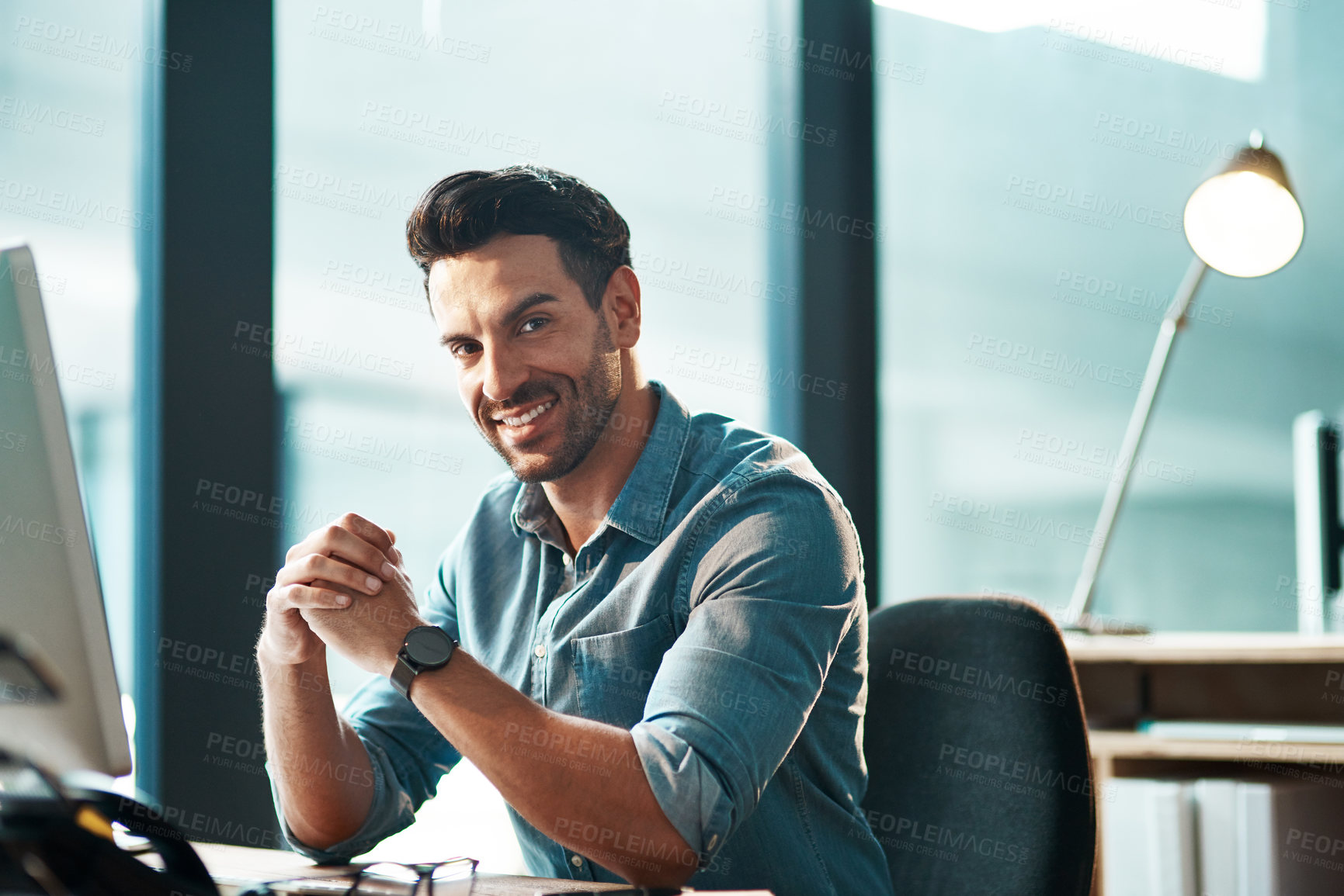 Buy stock photo Business man, portrait and smile at desk in office with confidence, happiness and commitment to company. Happy male entrepreneur at computer in startup agency with pride, professional and motivation