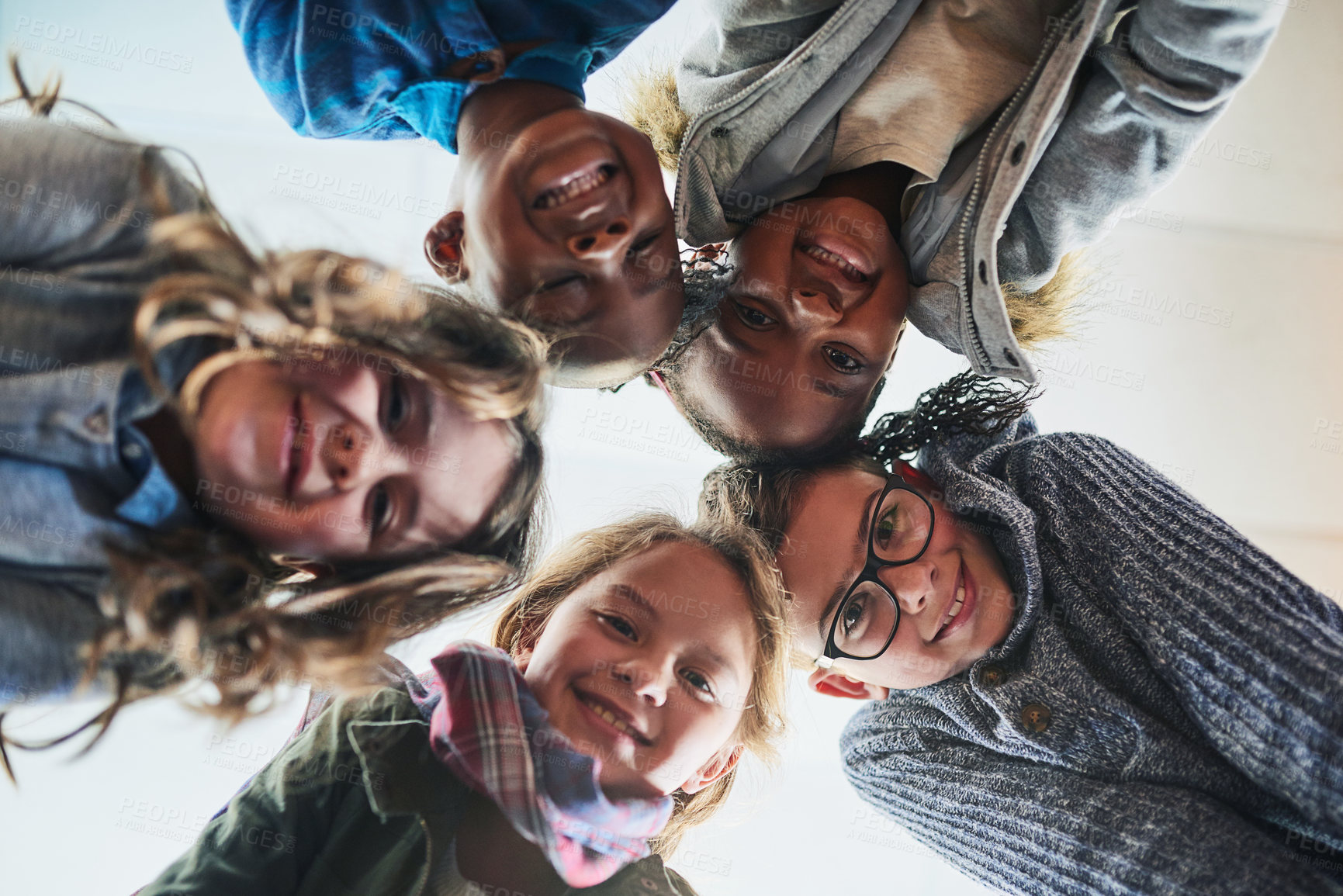 Buy stock photo Happy kids, portrait or circle with huddle below in childhood or youth development under sky background. Low angle, children or elementary students with smile for diversity, inclusion or kindergarten