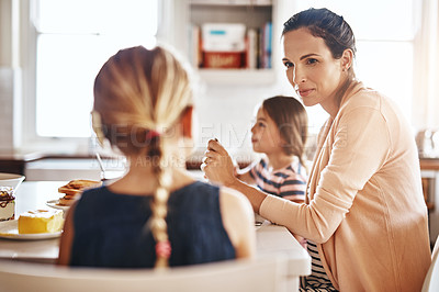 Buy stock photo Cropped shot of a family enjoying breakfast together