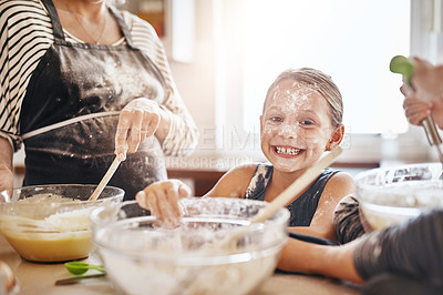 Buy stock photo Portrait, playing or messy kid baking in kitchen with a young girl smiling with flour on a dirty face at home. Smile, happy or parent cooking or teaching a fun daughter to bake for child development 