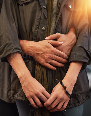 Buy stock photo Cropped shot of an unrecognizable and affectionate couple standing together